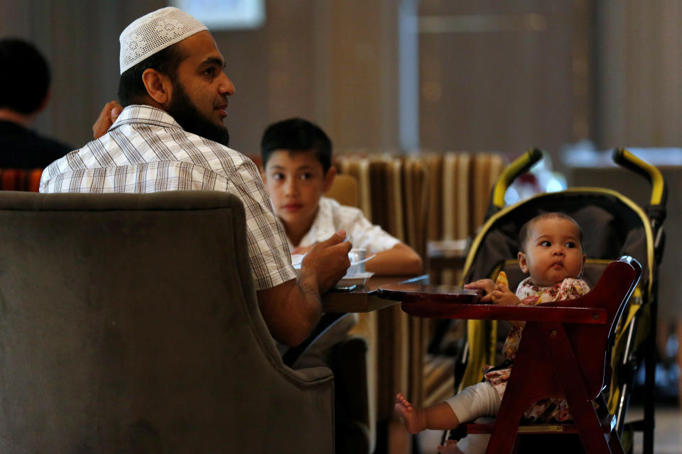 A Muslim family has their breakfast at the Al Meroz hotel in Bangkok