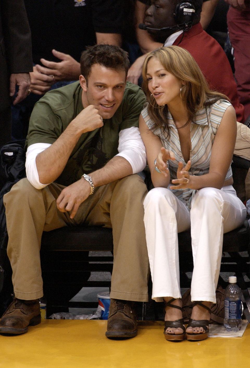 In this file photo, Ben Affleck and Jennifer Lopez attend a Los Angeles Lakers game in 2003 during their first engagement.