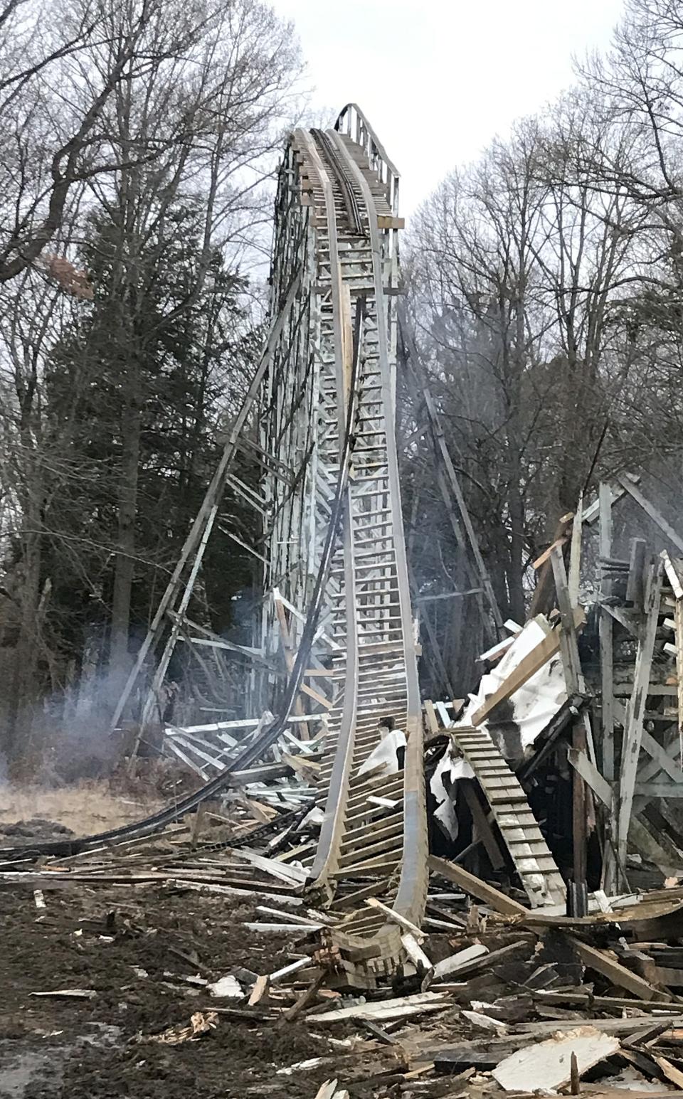 The first hill of the Blue Streak roller coaster at Conneaut Lake Park in Summit Township, Crawford County, is shown on Jan. 5, 2022, one day after a fire heavily damaged the coaster station, where patrons boarded the ride. The iconic wooden roller coaster, which opened in 1938, was being demolished on Monday before the fire began.