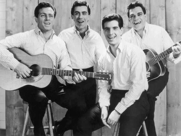 <p>The Four Seasons was one of the best-selling recording artists of the decade. The group had more than 25 hits over a five-year period beginning with 1962s “<a href="https://www.amazon.com/Sherry/dp/B00122AB40/?tag=syn-yahoo-20&ascsubtag=%5Bartid%7C10063.g.35225069%5Bsrc%7Cyahoo-us" rel="nofollow noopener" target="_blank" data-ylk="slk:Sherry;elm:context_link;itc:0;sec:content-canvas" class="link ">Sherry</a>.” That was followed by other hits that same year including “<a href="https://www.amazon.com/Big-Girls-Dont-Cry/dp/B001225A82/?tag=syn-yahoo-20&ascsubtag=%5Bartid%7C10063.g.35225069%5Bsrc%7Cyahoo-us" rel="nofollow noopener" target="_blank" data-ylk="slk:Big Girls Don’t Cry;elm:context_link;itc:0;sec:content-canvas" class="link ">Big Girls Don’t Cry</a>,” “<a href="https://www.amazon.com/Walk-Like-A-Man/dp/B00122CAQM/?tag=syn-yahoo-20&ascsubtag=%5Bartid%7C10063.g.35225069%5Bsrc%7Cyahoo-us" rel="nofollow noopener" target="_blank" data-ylk="slk:Walk Like a Man;elm:context_link;itc:0;sec:content-canvas" class="link ">Walk Like a Man</a>” (1963), “<a href="https://www.amazon.com/Dawn-Go-Away/dp/B00122CARQ/?tag=syn-yahoo-20&ascsubtag=%5Bartid%7C10063.g.35225069%5Bsrc%7Cyahoo-us" rel="nofollow noopener" target="_blank" data-ylk="slk:Dawn;elm:context_link;itc:0;sec:content-canvas" class="link ">Dawn</a>” (1964), and “<a href="https://www.amazon.com/Lets-Hang-On/dp/B00122CAXU/?tag=syn-yahoo-20&ascsubtag=%5Bartid%7C10063.g.35225069%5Bsrc%7Cyahoo-us" rel="nofollow noopener" target="_blank" data-ylk="slk:Let’s Hang On;elm:context_link;itc:0;sec:content-canvas" class="link ">Let’s Hang On</a>” (1965). Their unique doo-wop harmony style, punctuated by Frankie Valli’s falsetto, was instantly memorable. Their story was dramatized by the Tony Award-winning musical, <em>Jersey Boys</em>. </p>