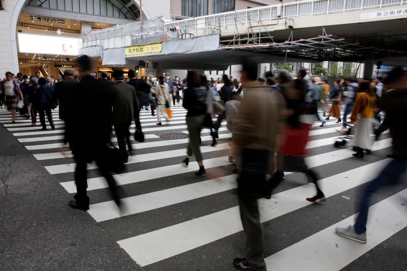 FILE PHOTO: Commuters pictured at a pedestrian crossing in Osaka