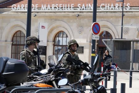 French soldiers patrol outside the Gare Saint Charles train station which was evacuated after an alert in Marseille, France, May 19, 2018. REUTERS/Philippe Laurenson