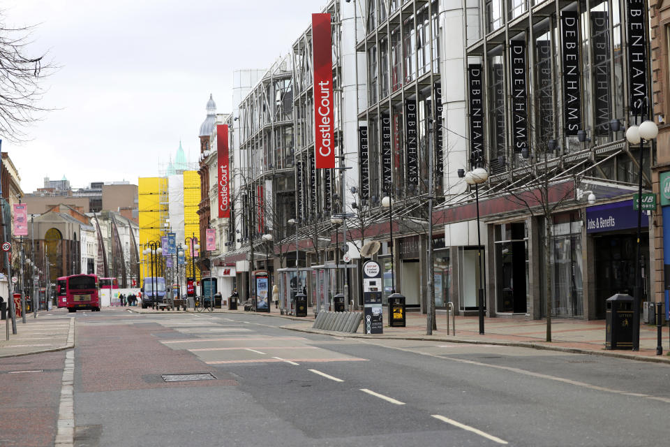 Deserted streets due to the coronavirus restrictions in Belfast city centre, Northern Ireland, Monday, March, 30, 2020. The new coronavirus causes mild or moderate symptoms for most people, but for some, especially older adults and people with existing health problems, it can cause more severe illness of death. (AP Photo/Peter Morrison)