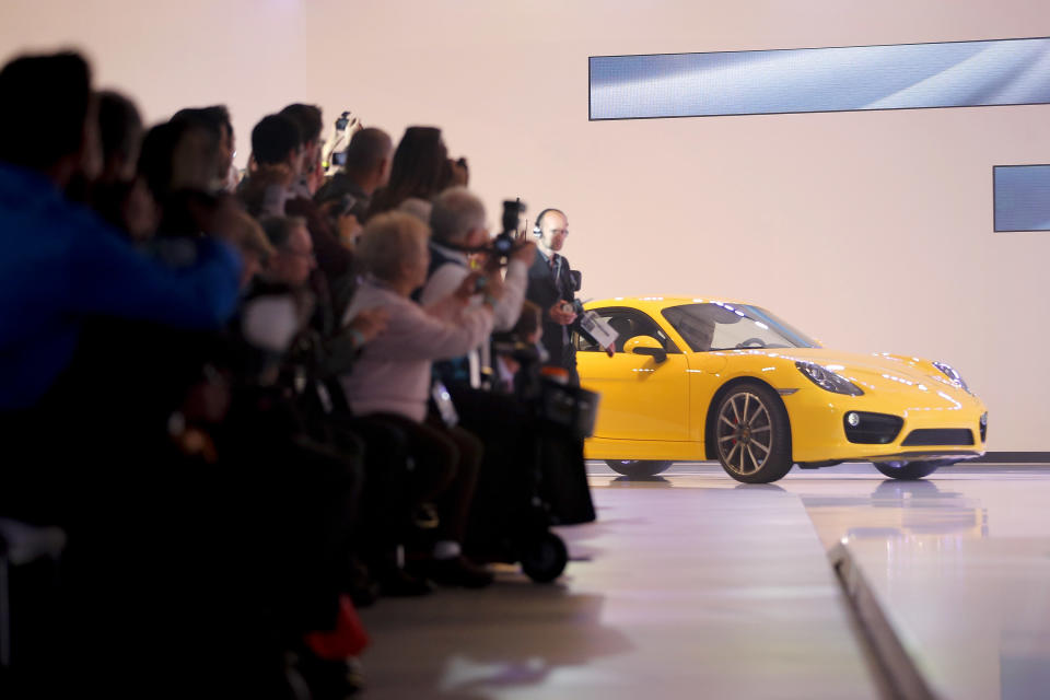 The new Porsche Cayman is introduced at the LA Auto Show in Los Angeles, Wednesday, Nov. 28, 2012. The annual Los Angeles Auto Show opened to the media Wednesday at the Los Angeles Convention Center. The show opens to the public on Friday, November 30. (AP Photo/Jae C. Hong)