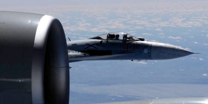 In this image released by the U.S. Air Force, a U.S. RC-135U flying in international airspace over the Baltic Sea, is intercepted by a Russian SU-27 Flanker on June 19, 2017.