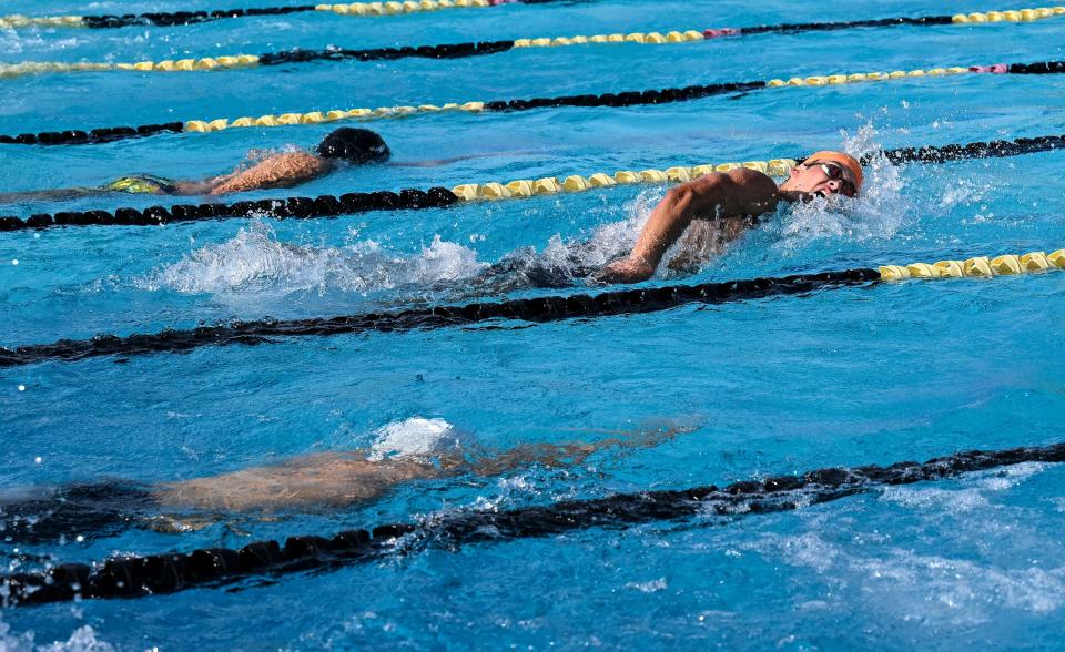 Redwood's Beau Gendron leads the boys 100 yard freestyle during the WYL swimming championships at Golden West High School on Friday, April 29, 2022. He won with a time of 49.66.