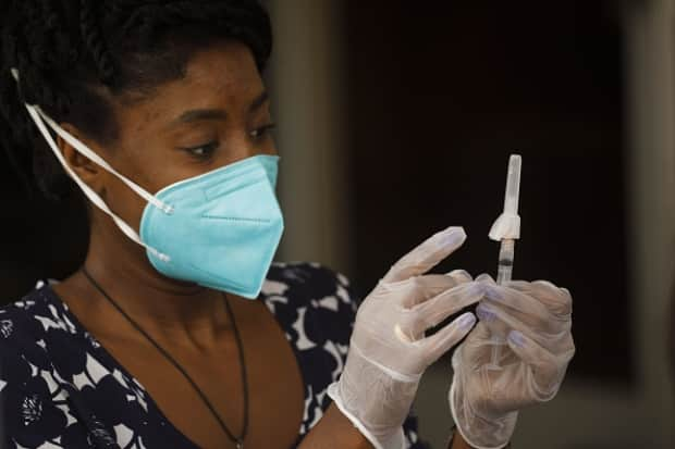 The newly approved AstraZeneca-Oxford vaccine is expected to arrive in Sask. this month. Residents ages 60 to 64 and phase one priority health care workers will be offered the first 15,500 doses, according to the province.  (Patrick T. Fallon/Bloomberg/Getty - image credit)