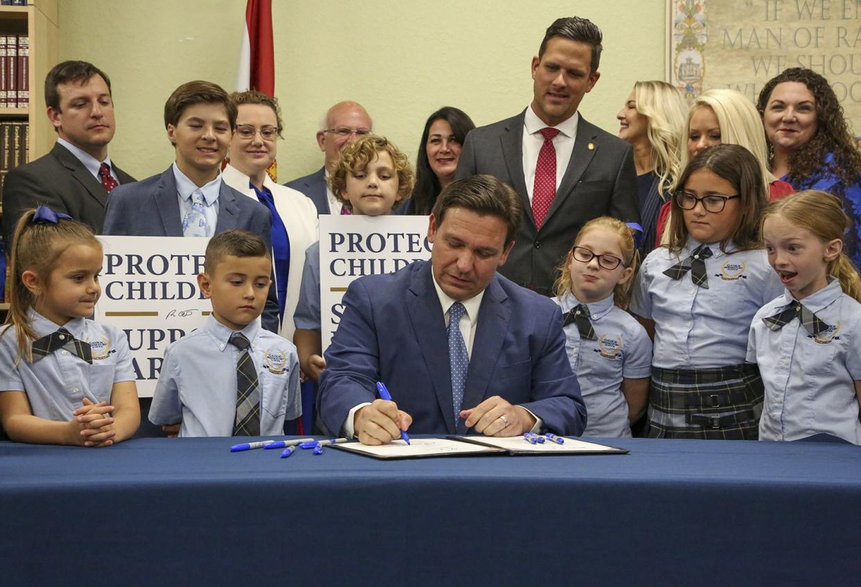 Florida Gov. Ron DeSantis signs the Parental Rights in Education bill on March 28, 2022. 