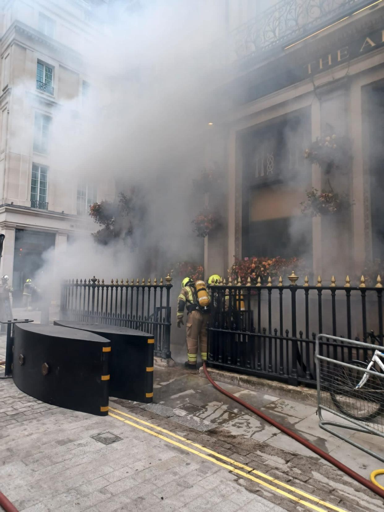 Firefighters battle a blaze in the basement of The Admiralty pub in Trafalgar Square (London Fire Brigade/PA)