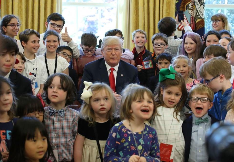 Donald Trump with children of the White House press corps