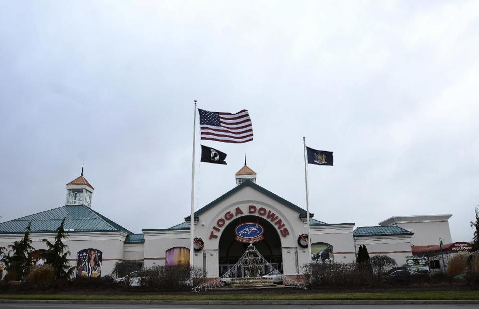 FILE – This Dec. 2, 2016, file photo shows the Tioga Downs in Nichols, N.Y. Thousands of new slot machines and gaming tables that are part of New York state's casino growth spurt will bring millions of dollars a year to treat problem gamblers. State lawmakers introduced a per-game fee similar to one in some other states in the law that authorized four new upstate New York casinos. (AP Photo/Heather Ainsworth, File)