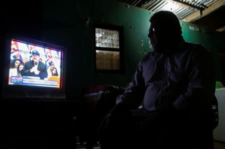 A man watches a TV broadcast of Nicaraguan President Daniel Ortega in Managua, Nicaragua February 21, 2019. REUTERS/Oswaldo Rivas