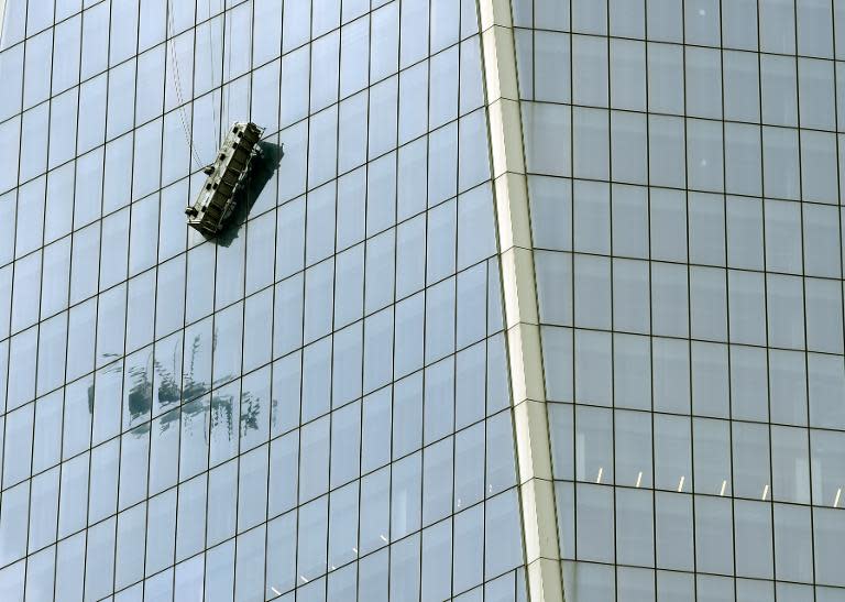 Two window washers were rescued at the new World Trade Center in New York November 12, 2014, after the cable secured to their platform snapped and left them dangling 69 floors up for nearly two hours