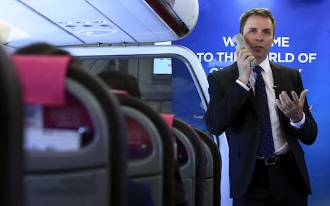 Wizz Air boss Jozsef Varadi at a press conference onboard a flight to Warsaw, Poland - Credit: Reuters