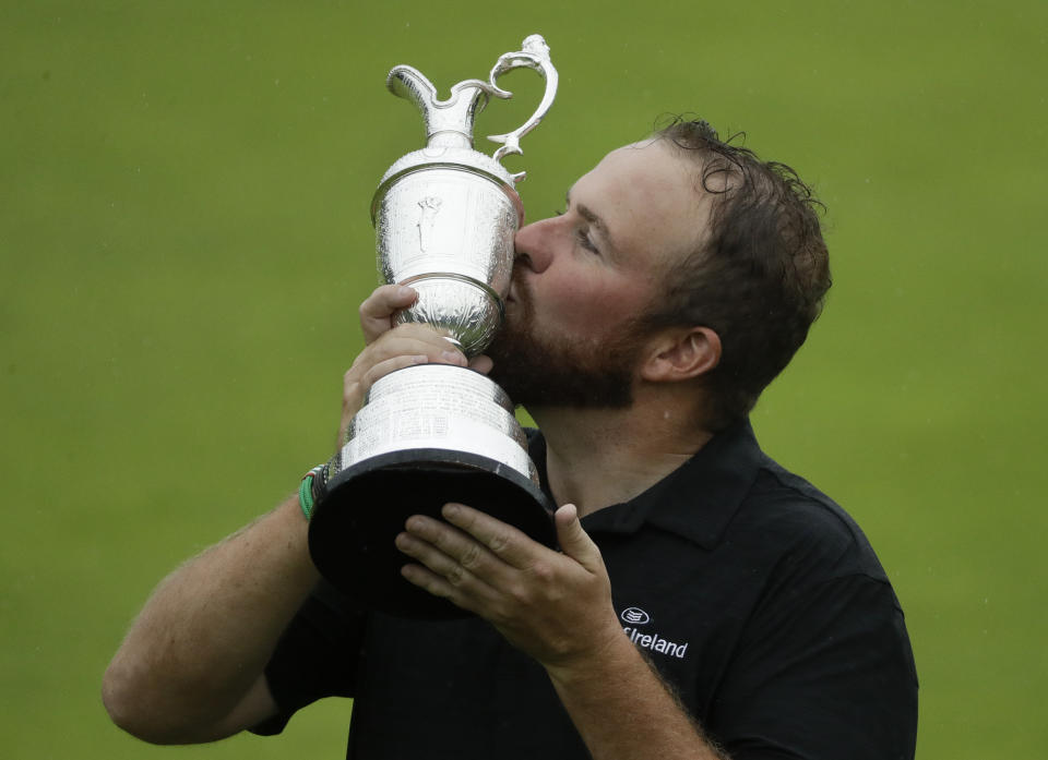 Ireland's Shane Lowry holds and kisses the Claret Jug trophy after winning the British Open Golf Championships at Royal Portrush in Northern Ireland, Sunday, July 21, 2019.(AP Photo/Matt Dunham)