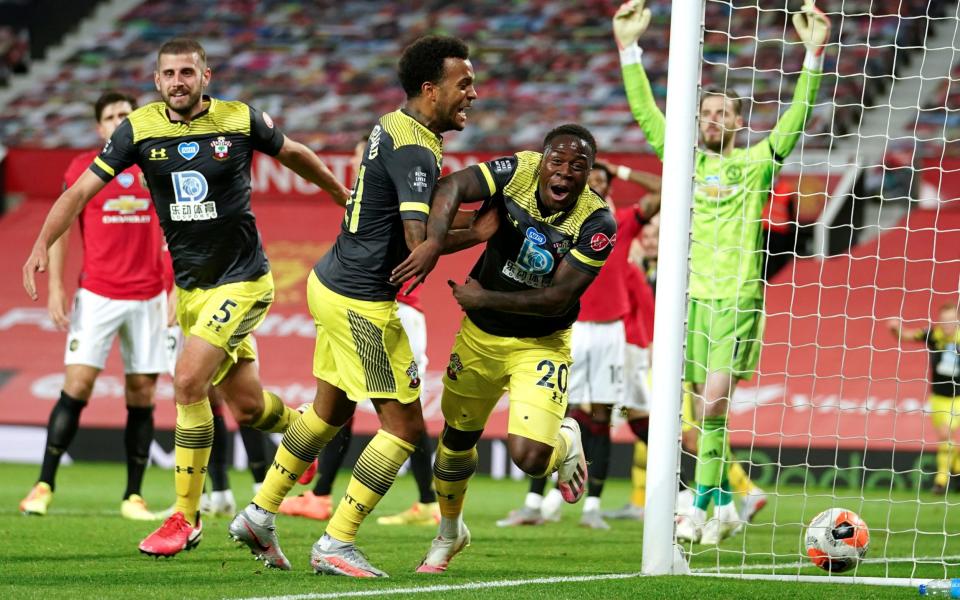 Southampton's Michael Obafemi, 20, celebrates after scoring his team's second goal during the English Premier League soccer match between Manchester United and Southampton at Old Trafford in Manchester, England, Monday, July 13, 2020. - Dave Thompson/AP