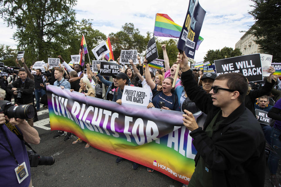 FILE - In this Oct. 8, 2019 file photo, supporters of LGBT rights stage a protest on the street in front of the U.S. Supreme Court in Washington. The Supreme Court has ruled that a landmark civil rights law protects gay, lesbian and transgender people from discrimination in employment. It's a resounding victory for LGBT rights from a conservative court. (AP Photo/Manuel Balce Ceneta, File)