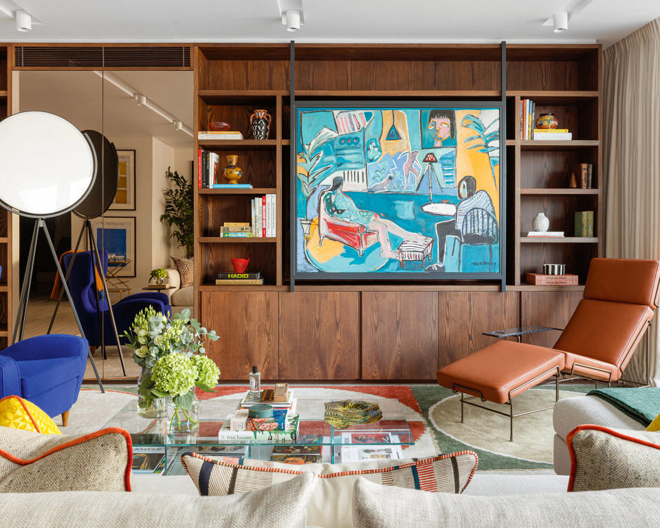 Living room with hidden TV behind art