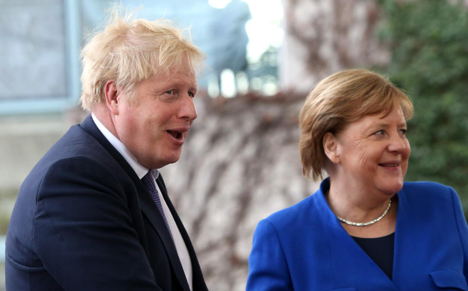 BERLIN, GERMANY - JANUARY 19: German Chancellor Angela Merkel (CDU, R) greets British Prime Minister Boris Johnson as he arrives for an international summit on securing peace in Libya at the German federal Chancellery on January 19, 2020 in Berlin, Germany. Leaders of nations and organizations linked to the current conflict are meeting to discuss measures towards reaching a consensus between the warring sides and ending hostilities. (Photo by Adam Berry/Getty Images)