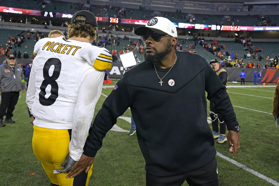 Pittsburgh Steelers head coach Mike Tomlin, right, and quarterback Kenny Pickett walk off the field following an NFL football game against the Cincinnati Bengals in Cincinnati, Sunday, Nov. 26, 2023. The Steelers won 16-10. (AP Photo/Carolyn Kaster)