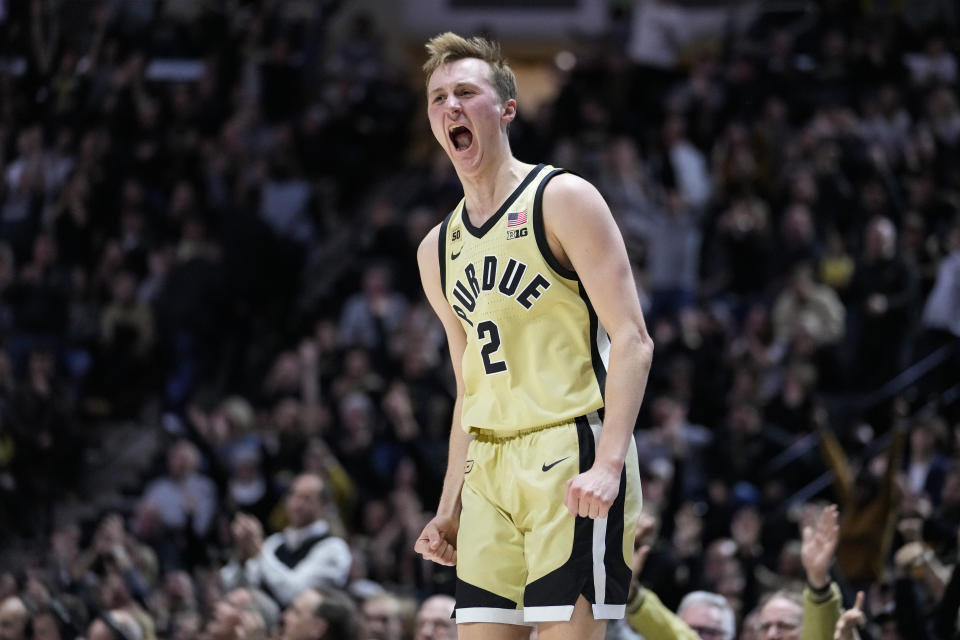 Purdue guard Fletcher Loyer (2) celebrates a three-point basket against Iowa during the second half of an NCAA college basketball game in West Lafayette, Ind., Thursday, Feb. 9, 2023. Purdue defeated Iowa 87-73. (AP Photo/Michael Conroy)