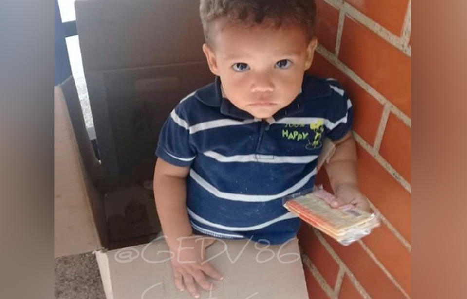 Venezuela toddler found abandoned, dumped in a cardboard biscuit box outside flats.