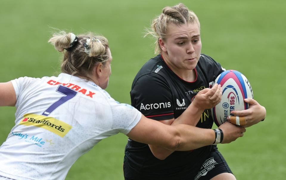 Mackenzie Carson of Saracens breaks through the tackle of Rachel Johnson of Exeter Chiefs to score a try during the Allianz Premier 15s Final match between Saracens Women and Exeter Chiefs Women - Getty Images/David Rogers