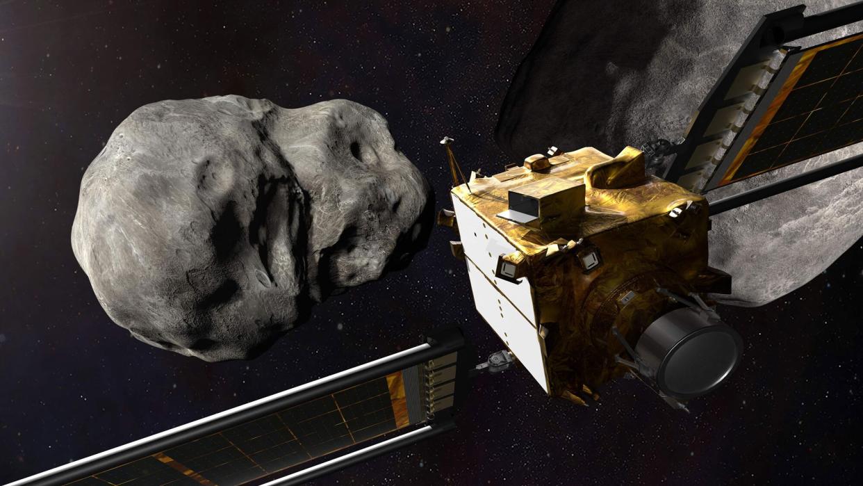 This file artist's illustration obtained from NASA on November 4, 2021 shows the DART spacecraft from behind prior to impact at the Didymos binary system. - NASA on Monday will attempt a feat humanity has never before accomplished: deliberately smacking a spacecraft into an asteroid to slightly deflect its orbit, in a key test of our ability to stop cosmic objects from devastating life on Earth. (Photo by Handout / NASA / AFP) / RESTRICTED TO EDITORIAL USE - MANDATORY CREDIT "AFP PHOTO /NASA/Johns Hopkins APL'" -"
