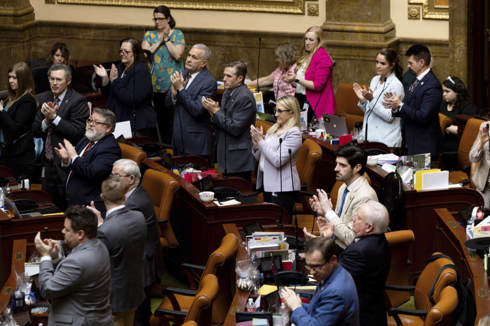 Members of the Utah House of Representatives applaud for the athlete who was the subject of school board member Natalie Cline's comments on social media after passing the House Concurrent Resolution Condemning and Censuring State School Board Member Natalie Cline at the Capitol in Salt Lake City on Thursday, Feb. 15, 2024. (Megan Nielsen/The Deseret News via AP)