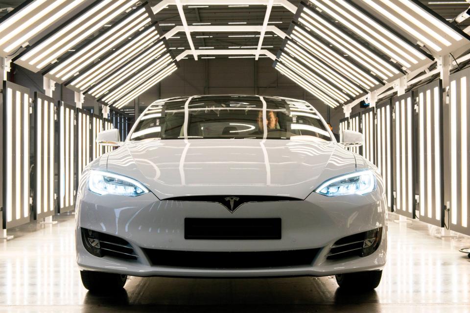 Brand new Tesla Model S Tilburg, Netherlands. A brand new Tesla Model S gets checked out under an abundance of light. Tilburg Tesla Motors Noord-Brabant Nederkand Copyright: xGuidoxKoppesx