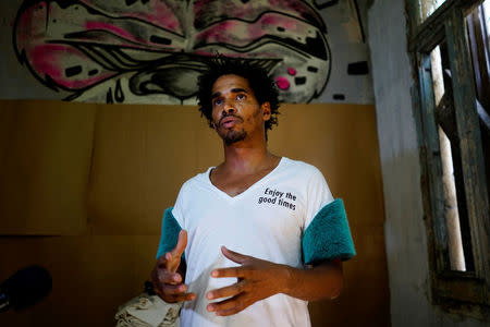 Organizer of the "00Biennial" Luis Manuel Otero Alcantara speaks during an interview at his home in Havana, Cuba, May 2, 2018. REUTERS/Alexandre Meneghini