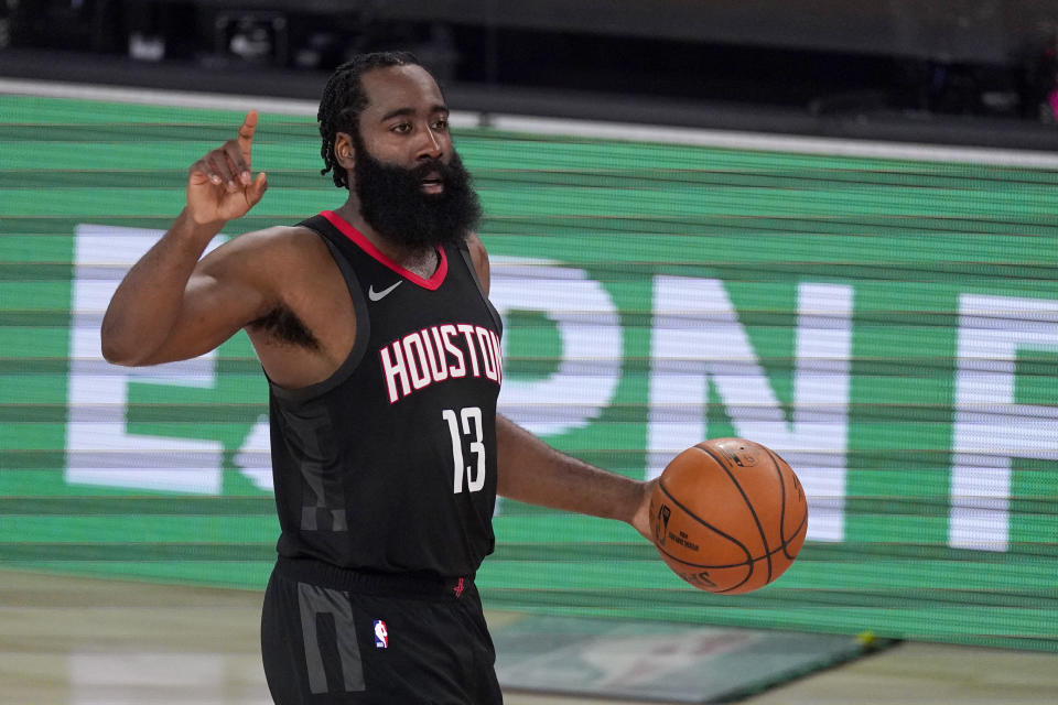 Houston Rockets' James Harden (13) signals to the offense during the second half of an NBA first-round playoff basketball game in Lake Buena Vista, Fla., Wednesday, Sept. 2, 2020. (AP Photo/Mark J. Terrill)