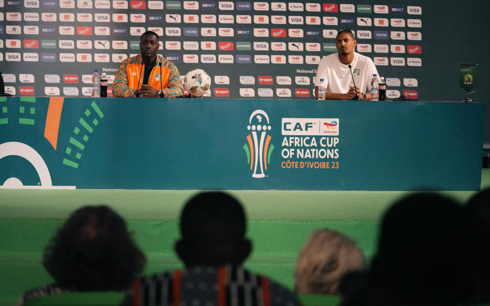 Ivory Coast's interim Soccer coach Emerse Fae, left, Sebastien Haller, right, sit, during a media conference in Abidjan, Ivory Coast, Saturday, Feb. 10, 2024. Ivory Coast will play the African Cup of Nations soccer Final match against Nigeria on Sunday. (AP Photo/Sunday Alamba)
