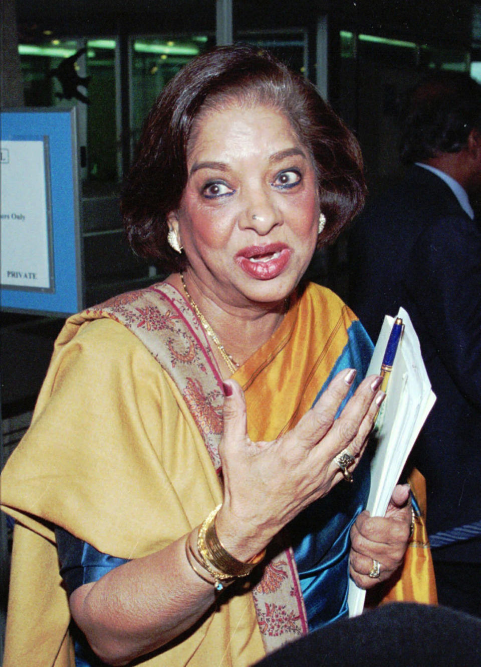 FILE - Nafis Sadik, Pakistani candidate to the post of World Health Organization director general, briefs the media after her presentation at the WHO Executive Board at Geneva, Switzerland, on Jan. 26, 1998. Sadik, a Pakistani doctor who championed women's health and rights and spearheaded the breakthrough action plan adopted by 179 countries at the 1994 U.N. population conference, died four days before her 93rd birthday, her son said late Monday, Aug. 15, 2022. Omar Sadik said his mother died of natural causes at her home in New York on Sunday night. (AP Photo/Donald Stampfli, File)