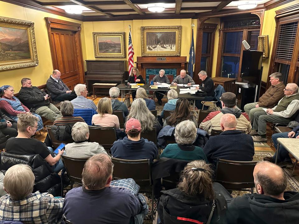 Residents attend a town selectmen meeting on Jan. 22, 2024, in Littleton, N.H. Littleton town manager Jim Gleason, whose late son was gay, resigned effective Friday, Feb. 2, 2024, to take a stand against the anti-LGBTQ sentiments being expressed by some people in Littleton.