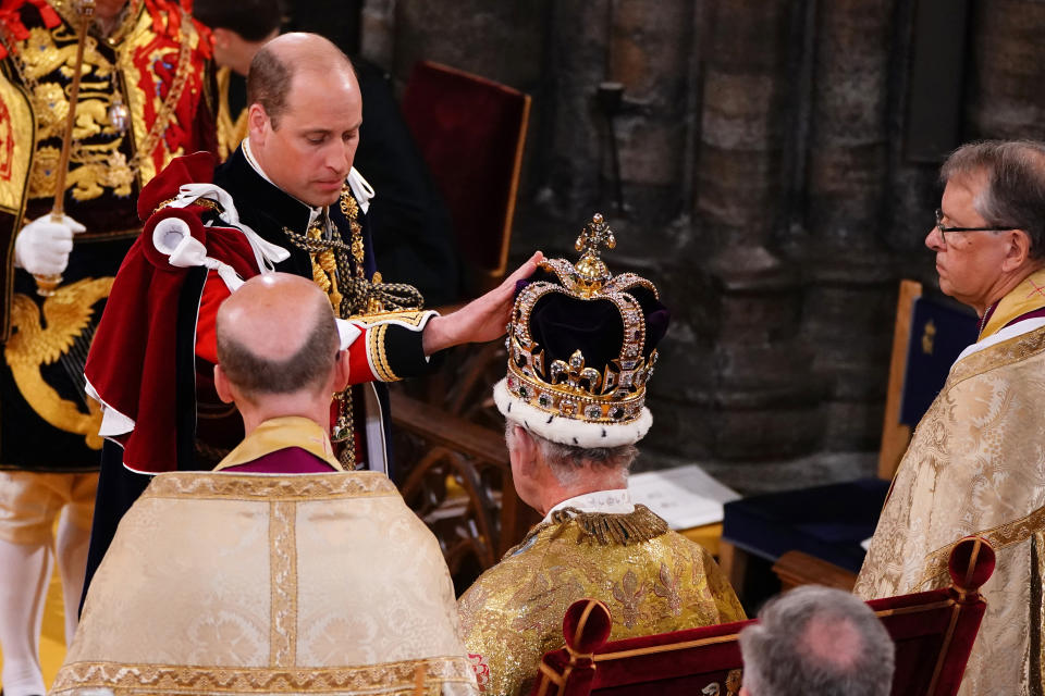 <p>LONDON, ENGLAND - MAY 06: Prince William, Prince of Wales touches the St Edward's Crown his father's, King Charles III during the King's Coronation Ceremony inside Westminster Abbey on May 6, 2023 in London, England. The Coronation of Charles III and his wife, Camilla, as King and Queen of the United Kingdom of Great Britain and Northern Ireland, and the other Commonwealth realms takes place at Westminster Abbey today. Charles acceded to the throne on 8 September 2022, upon the death of his mother, Elizabeth II. (Photo by Yui Mok - WPA Pool/Getty Images)</p> 