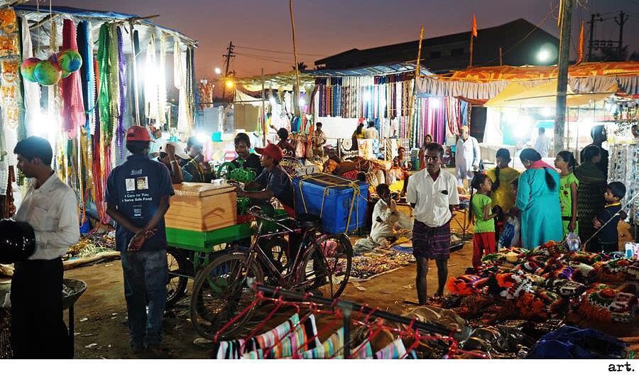 Olympus 9mm body cap image of a night market in India