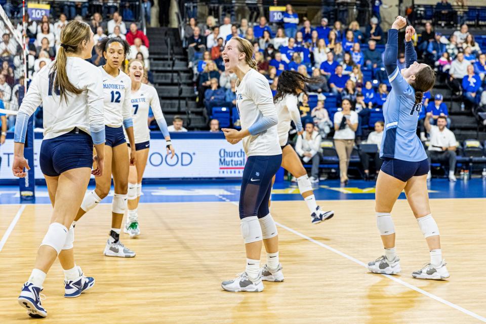 Marquette players celebrate their win over Creighton on Nov. 19 that won the Golden Eagles a share of the Big East regular-season title. Marquette has won a school-record 28 matches this season, including back-to-back sweeps to open the NCAA Tournament. The Golden Eagles play top-seeded Texas in the Sweet 16 on Thursday.