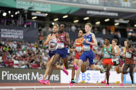 Jimmy Gressier, of France, Abdihamid Nur, of the United States, Mohamed Katir, of Spain, and Narve Gilje Nordas, of Norway, from left, compete in a Men's 5000-meters heat during the World Athletics Championships in Budapest, Hungary, Thursday, Aug. 24, 2023. (AP Photo/Matthias Schrader)