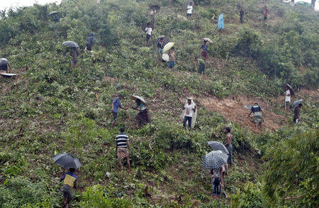 Rohingya refugees clear a hillside to set up shelters in Cox's Bazar, Bangladesh, September 20, 2017. REUTERS/Cathal McNaughton