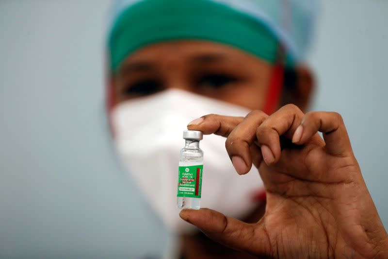 FILE PHOTO: A nurse displays a vial of COVISHIELD, the AstraZeneca COVID-19 vaccine manufactured by Serum Institute of India, in Mumbai