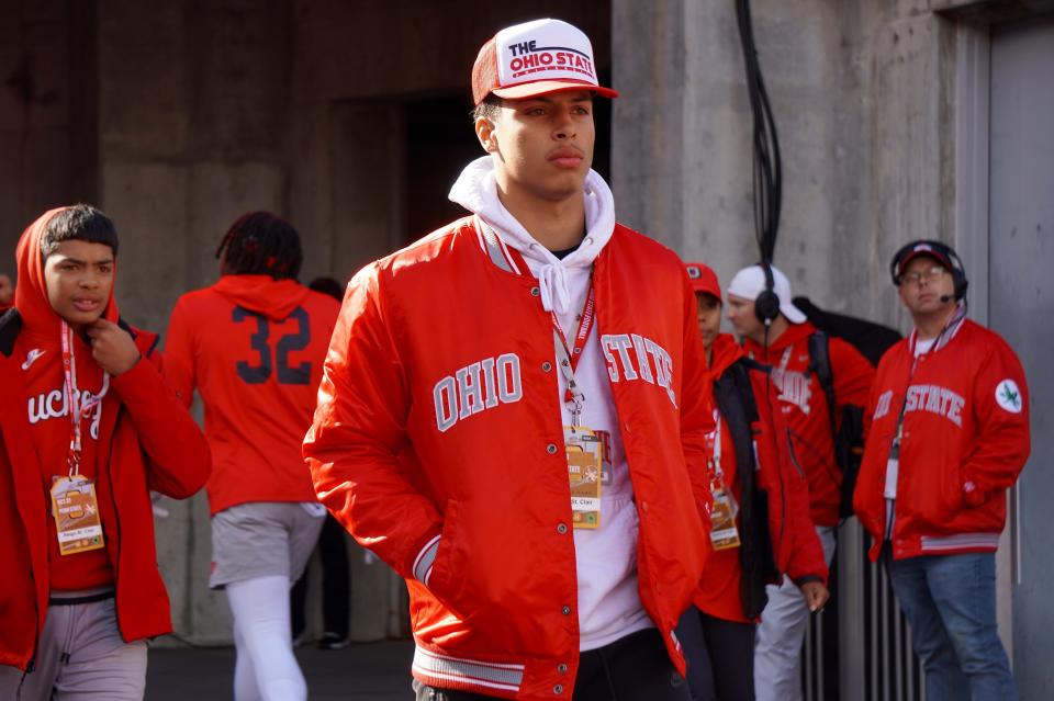 Recruit Tavien St. Clair watches Ohio State warm up before playing Penn State Oct. 21, 2023 at Ohio Stadium.