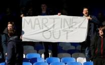 Britain Football Soccer - Everton v AFC Bournemouth - Barclays Premier League - Goodison Park - 30/4/16 Everton fans with a banner regarding Everton manager Roberto Martinez Action Images via Reuters / Jason Cairnduff Livepic