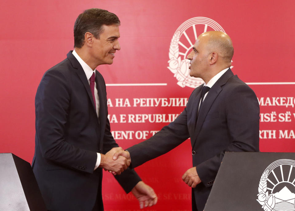 Spain's Prime Minister Pedro Sanchez left and North Macedonia's Prime Minister Dimitar Kovacevski, right, shake hands after their joint news conference in the government building in Skopje, North Macedonia, on Sunday, July 31, 2022. Spanish Prime Minister Pedro Sanchez is on a one-day official visit to North Macedonia as a part of his Western Balkans tour. (AP Photo/Boris Grdanoski)