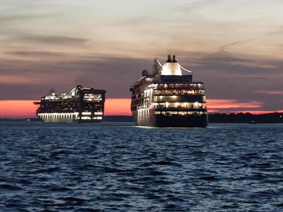 A large cruise ship leaves Newport Harbor.