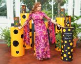 <p>Brooke Shields shows off the unique sleeves on her vibrant dress at the Veuve Clicquot Cocktail Hour at the New York Botanical Garden on June 3 in N.Y.C. </p>