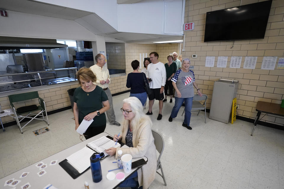 People line up to vote at a polling place at St. Rita's Catholic School on election day in Harahan, La., Saturday, Oct. 14, 2023. (AP Photo/Gerald Herbert)