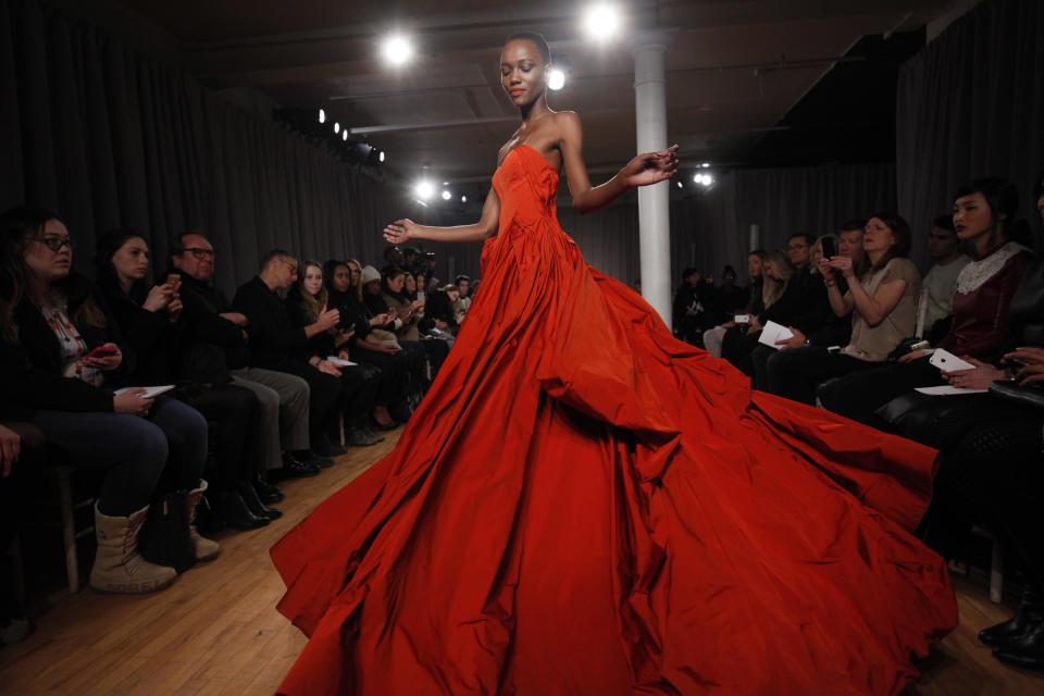 The Zac Posen Fall 2014 collection is modeled during Fashion Week in New York, Monday, Feb. 10, 2014. (AP Photo/Jason DeCrow)