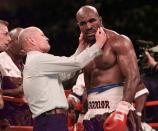 <p>Evander Holyfield has his right ear checked by referee Mills Lane after he was bit in the ear by Mike Tyson in the third round of their WBA Heavyweight match Saturday, June 28, 1997, at the MGM Grand in Las Vegas. (AP Photo/Mark J. Terrill) </p>