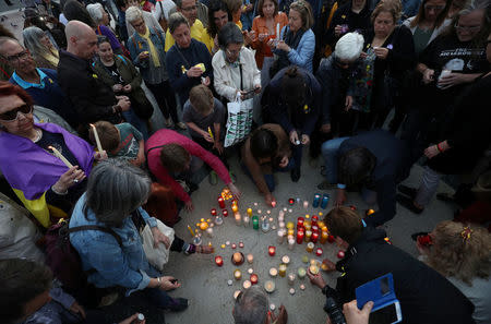 Members of the Committee for the Defence of the Republic (CDR) light candles in memory of jailed Catalonian politicians at Catalunya square in Barcelona, Spain April 27, 2018. REUTERS/Albert Gea